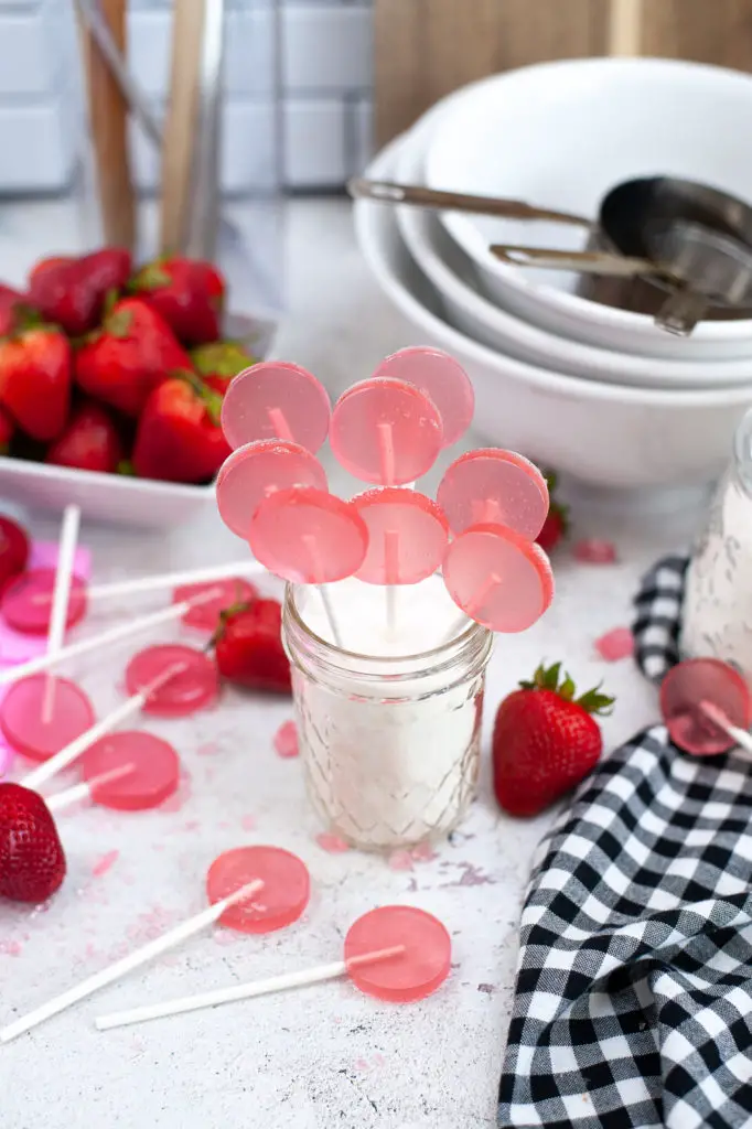 Strawberry lollypops in a jar. 