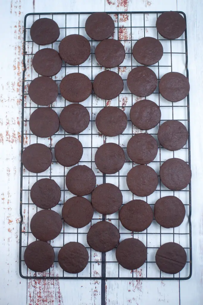Cooked Copycat Girl Scout Thin Mints on a drying rack. 