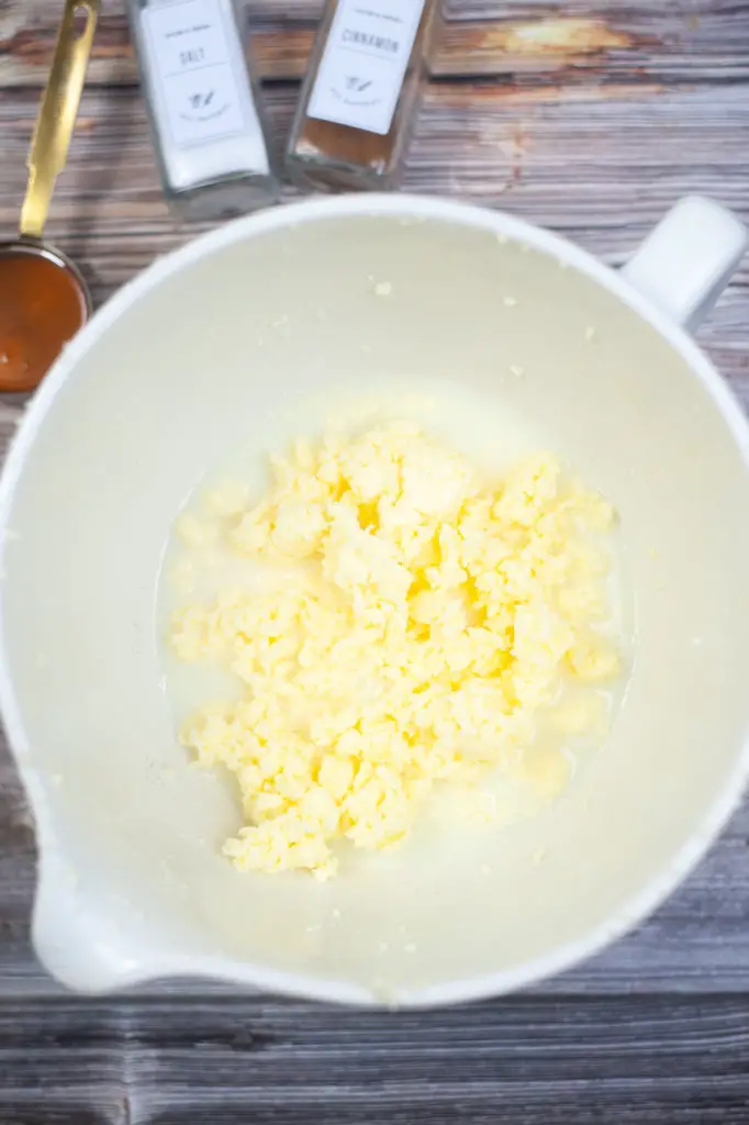 Butter and buttermilk separated in a mixing bowl. 