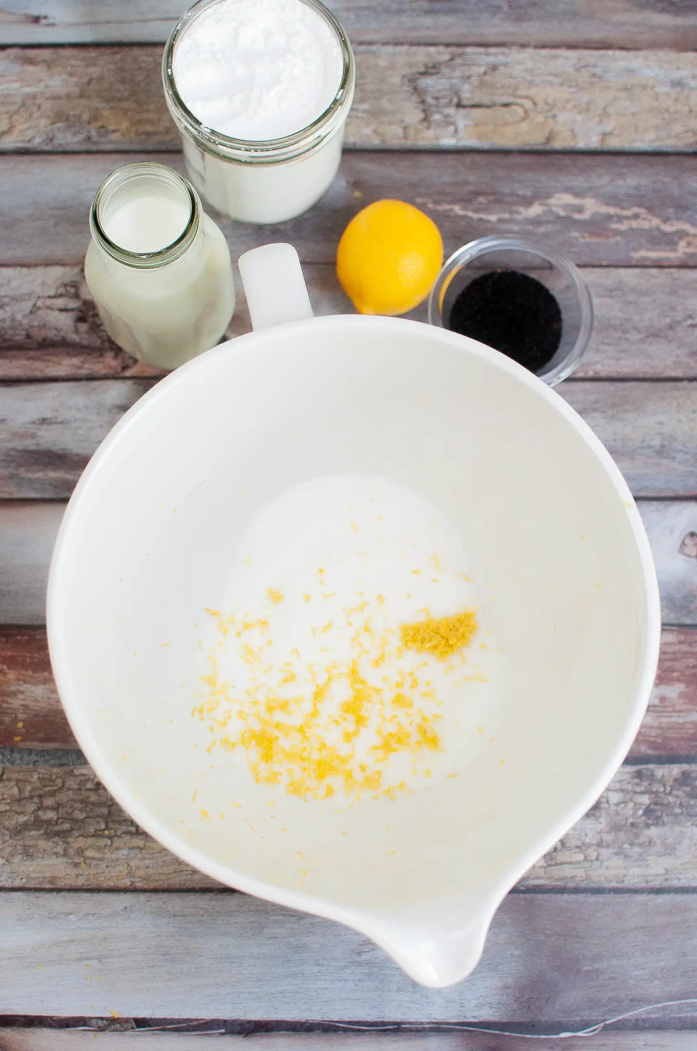 Ingredients for Lemon Poppyseed muffins in a mixing bowl.
