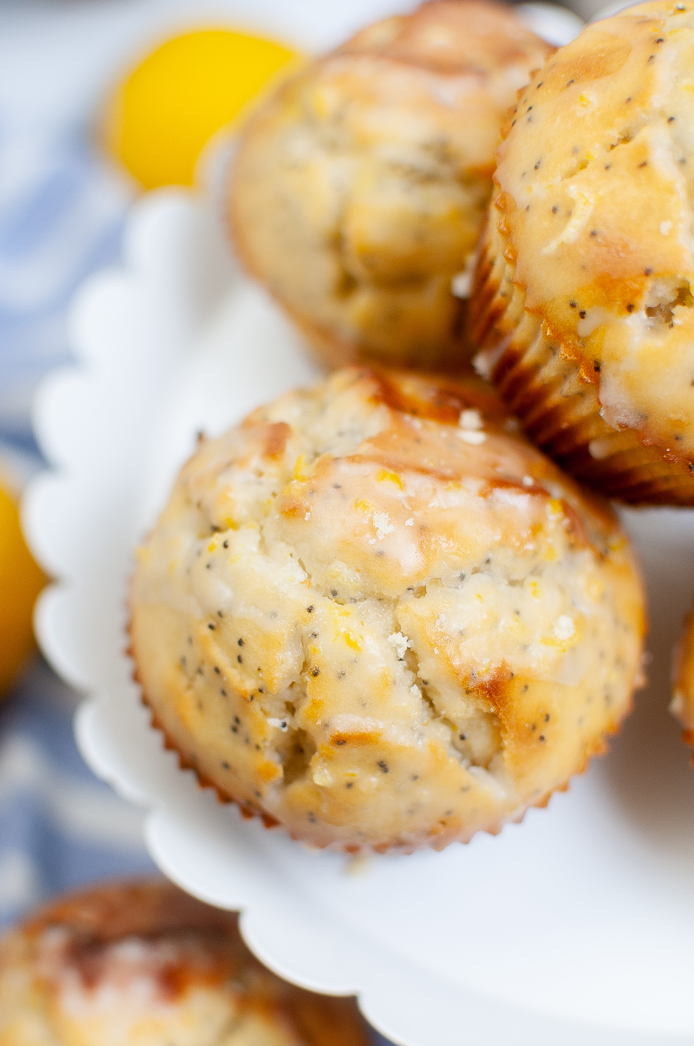 Lemon Poppyseed muffins stacked together.