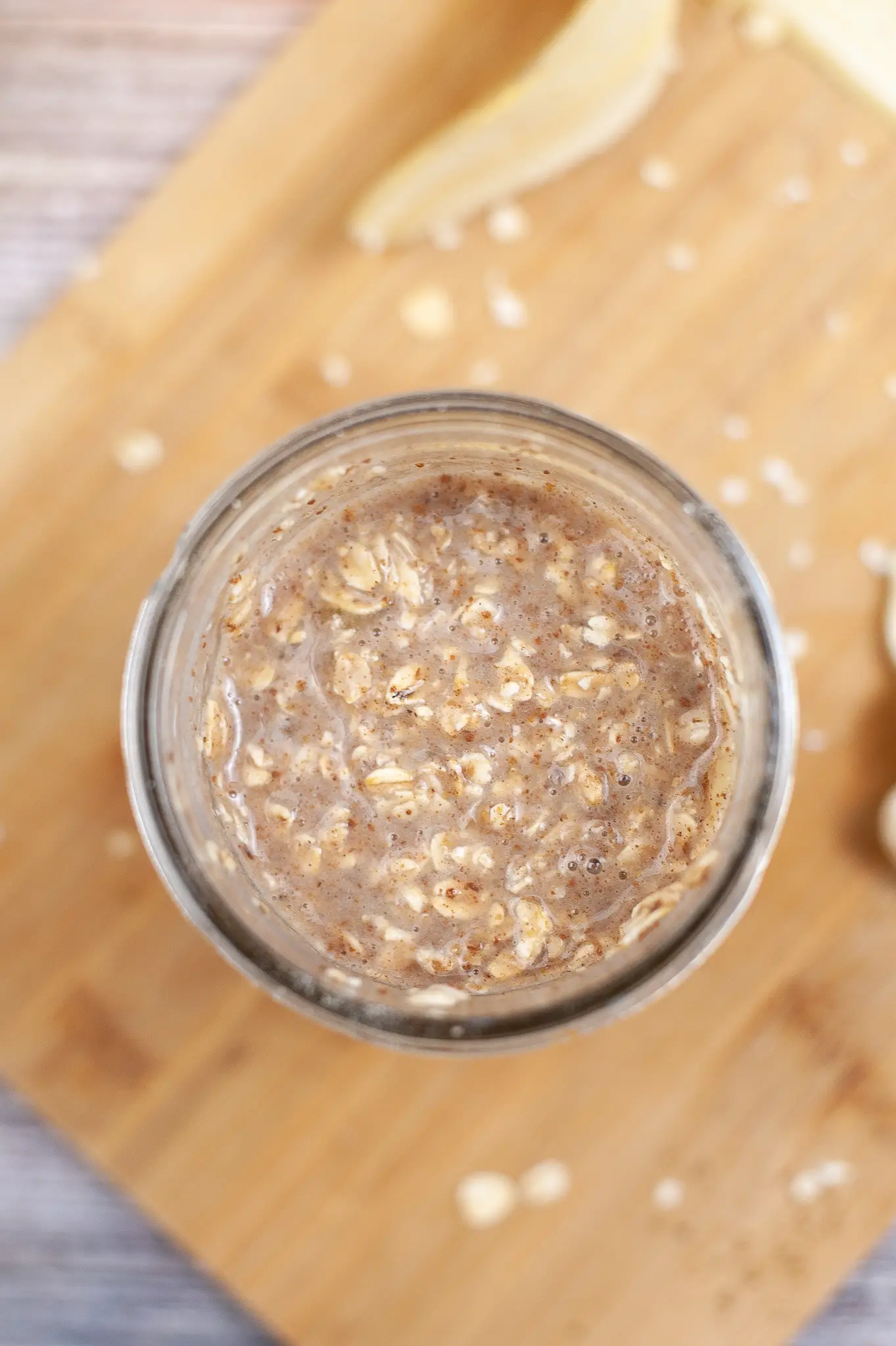 Ingredients for Chocolate Chip Banana Overnight Oats mixed in a jar.