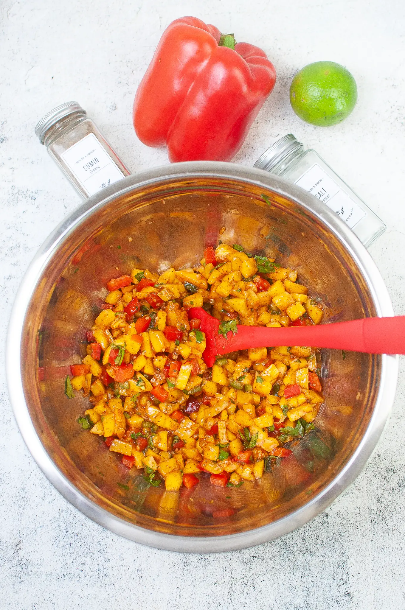 Prepared mango salsa ingredients mixed in a bowl.
