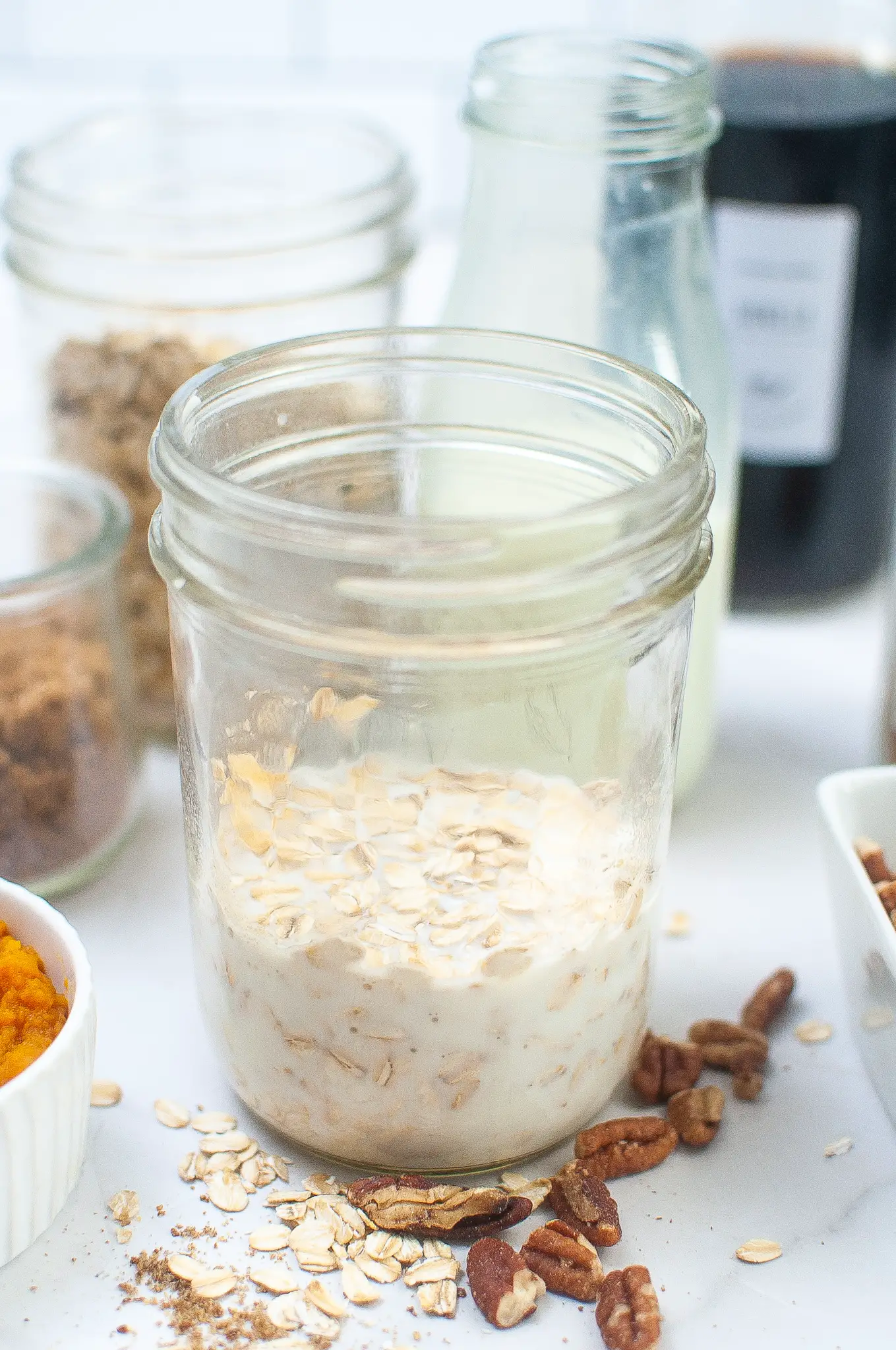1/2 cup Whole milk & 1/2 cup Old fashioned oats in a jar.