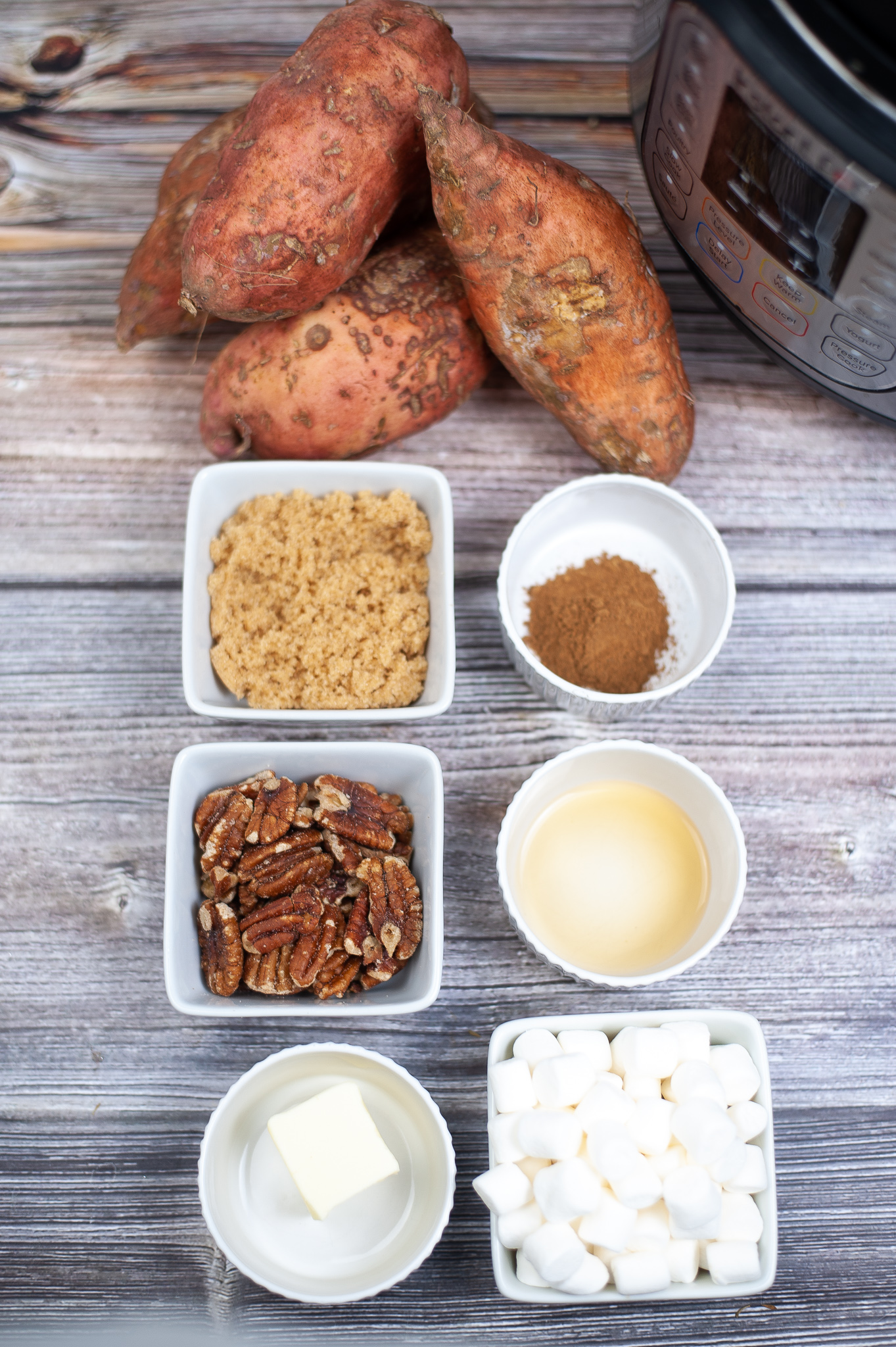 Ingredients in bowls or plates for the sweet potato casserole.