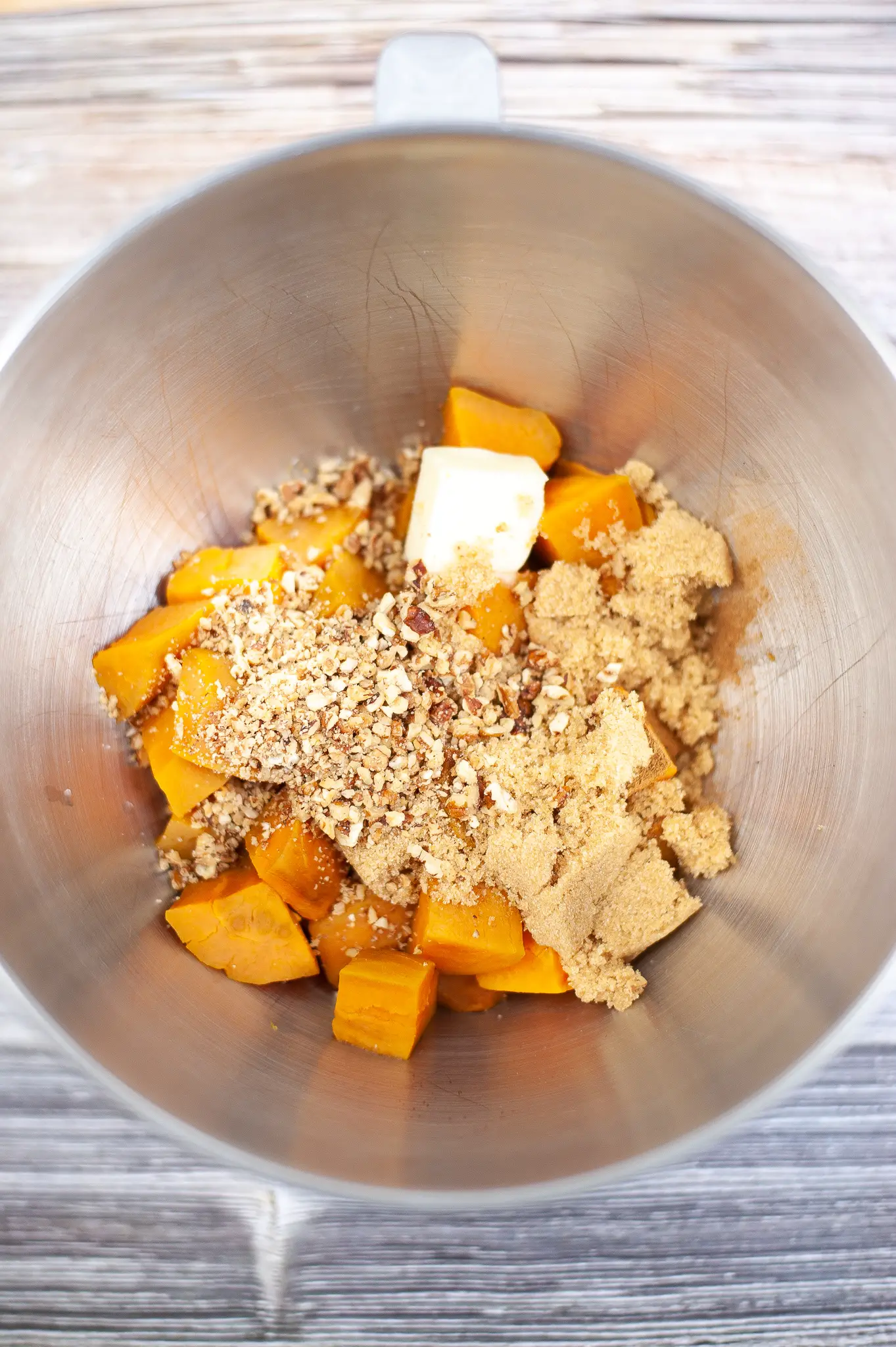 Cooked sweet potatoes, and other ingredients in a bowl.